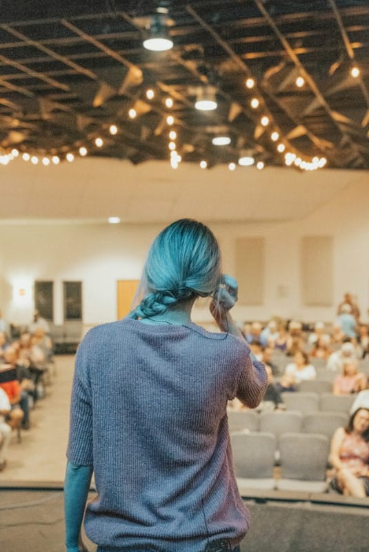 Women Speaking in front of the audience